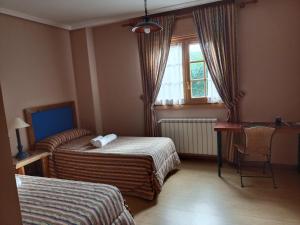 Rúm í herbergi á Hotel Pico Espiguete