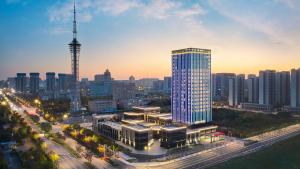 a view of a city with a tall building at Hilton Garden Inn Nantong Rudong in Nantong