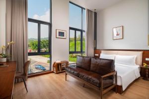 Posteľ alebo postele v izbe v ubytovaní Wuyu Hotel, Smart Park & Happy Valley Jinshansi Metro