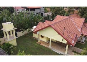 an overhead view of a house with a red roof at Lone Star Residence in Jaffna