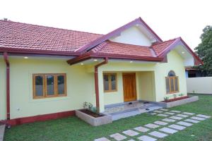 a model home with a red roof at Lone Star Residence in Jaffna