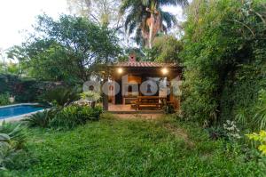a small house with a pool in a yard at Wonderful Studio In The City, Close To Sh Del Sol in Asunción