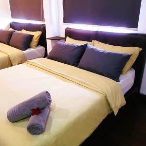Katil atau katil-katil dalam bilik di CassaKaseh Guest House