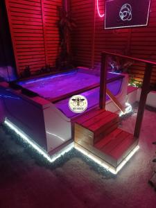 a hot tub with led lights in a room at Casa H2o de BEEHOUSE in Villa Alemana