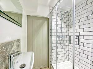 a bathroom with a shower and a sink at The Frome Studio in Frome