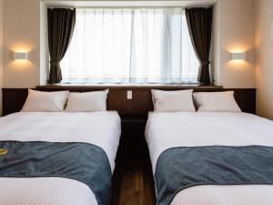 Postel nebo postele na pokoji v ubytování Private Condo Chatan Jagaru by Coldio Premium + 33 fotografií
