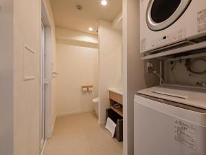 Kuchyň nebo kuchyňský kout v ubytování Private Condo Chatan Jagaru by Coldio Premium