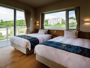 Postel nebo postele na pokoji v ubytování Private Condo Chatan Jagaru by Coldio Premium