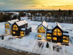 an aerial view of a home in the snow at SOFA VILLAS MONT SAINTE-ANNE in Beaupré