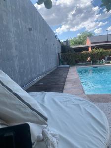 a mattress sitting next to a swimming pool at La Mora Home - Casa de Campo in Victoria