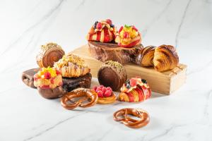 a group of pastries and pretzels on a table at Hilton Beijing Wangfujing in Beijing