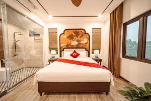 Postel nebo postele na pokoji v ubytování Lake Hotel Sóc Sơn + 28 fotografií