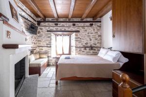 A bed or beds in a room at Archontiko Michael Pelion