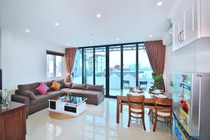 a living room with a couch and a table at Amor home III in Hanoi