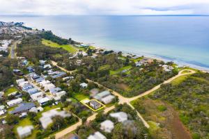 an aerial view of a neighborhood with houses and the ocean at Lanigan's - By the Bay in Saint Leonards