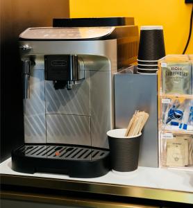 a coffee maker sitting on top of a shelf at Capsule Transit Sleep Lounge KLIA T1 - Landside in Sepang