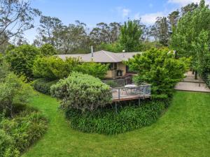 an aerial view of a house with trees and a yard at Summer House in Wentworth Falls