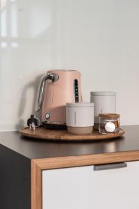 a toaster sitting on top of a kitchen counter at MAC Middle Park by Melbourne Apartment Collection in Middle Park