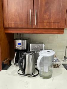 a kitchen counter with a coffee maker and a blender at Homestay- private room and bathroom in Whitby
