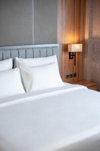 Taman Prakerti Bhuana Hotel客房内的一张或多张床位
