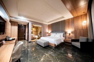 Taman Prakerti Bhuana Hotel客房内的一张或多张床位