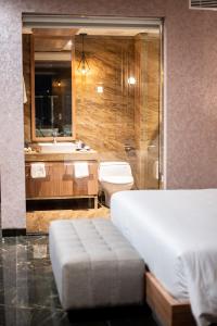 Taman Prakerti Bhuana Hotel客房内的一张或多张床位
