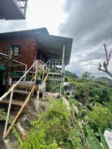 a building with a staircase in front of it at Hilltop view - Phi Phi in Phi Phi Islands