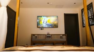 TV o dispositivi per l'intrattenimento presso Yangzhou Aihehua Boutique Homestay
