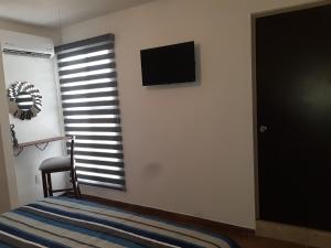 TV a/nebo společenská místnost v ubytování PUNTA AZUL