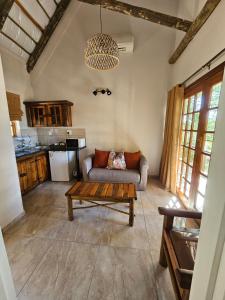 a living room with a couch and a coffee table at Riverside Lodge & Conference Center in Aliwal North