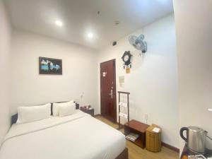 A25 Hotel - 25 Trương Định 객실 침대
