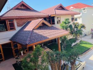 an overhead view of a house with a roof at Kum-Chan House Hotel (เฮือนก่ำจันทร์) in Nan