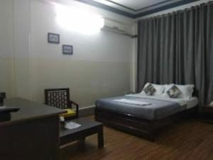 Giường trong phòng chung tại Tribal Inn Dimapur