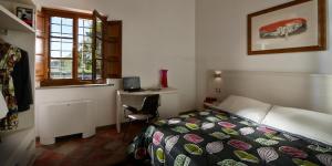 Posteľ alebo postele v izbe v ubytovaní B&B ai Condotti di Pisa da Filippo