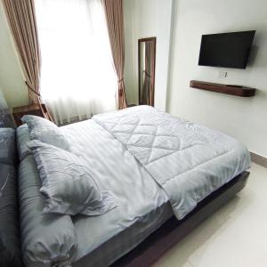 Postel nebo postele na pokoji v ubytování Kala Guest House