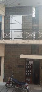 a motorcycle parked in front of a building at KEERTHISH NIVAS Home stay in Tiruvannāmalai