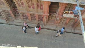 a group of people standing in front of a building at Karina art Home stay in Bikaner