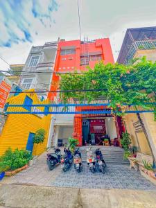 a group of motorcycles parked in front of a building at Hoàng Sơn's Home in Can Tho