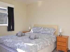 a bedroom with a bed with two pillows on it at 2 bed in Bude 58818 in Bude