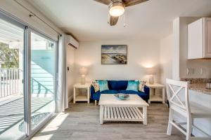 a living room with a couch and a table at Sand Dollar 1 in Fort Myers Beach