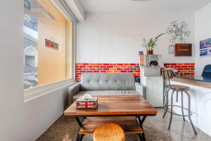 a living room with a couch and a table at Wei Yuan Hotel in Kenting