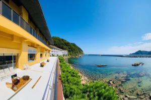 a view of the water from a building at Okukinosaki Seaside Hotel in Toyooka