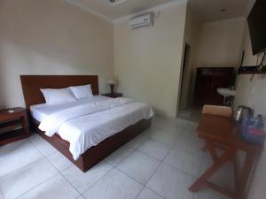 Postel nebo postele na pokoji v ubytování Guest House Sudara