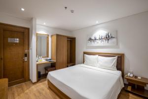 Hai Trieu Hotel客房内的一张或多张床位
