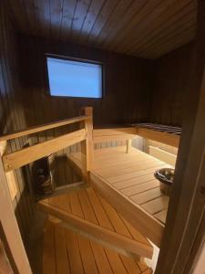 a small room with a bunk bed in a boat at Apartment HILLI in Rovaniemi