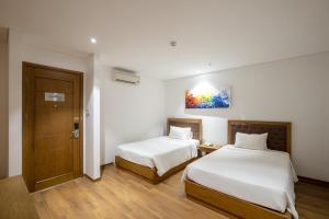 Hai Trieu Hotel客房内的一张或多张床位
