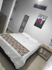 Кровать или кровати в номере Hostal Bon Hábitat