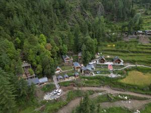 an aerial view of a house in a forest at Tree house Latos Tandi in Jibhi