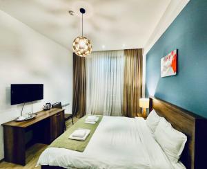 TV a/nebo společenská místnost v ubytování Hotel King Tom