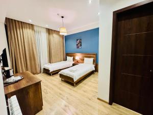 Voodi või voodid majutusasutuse Hotel King Tom toas